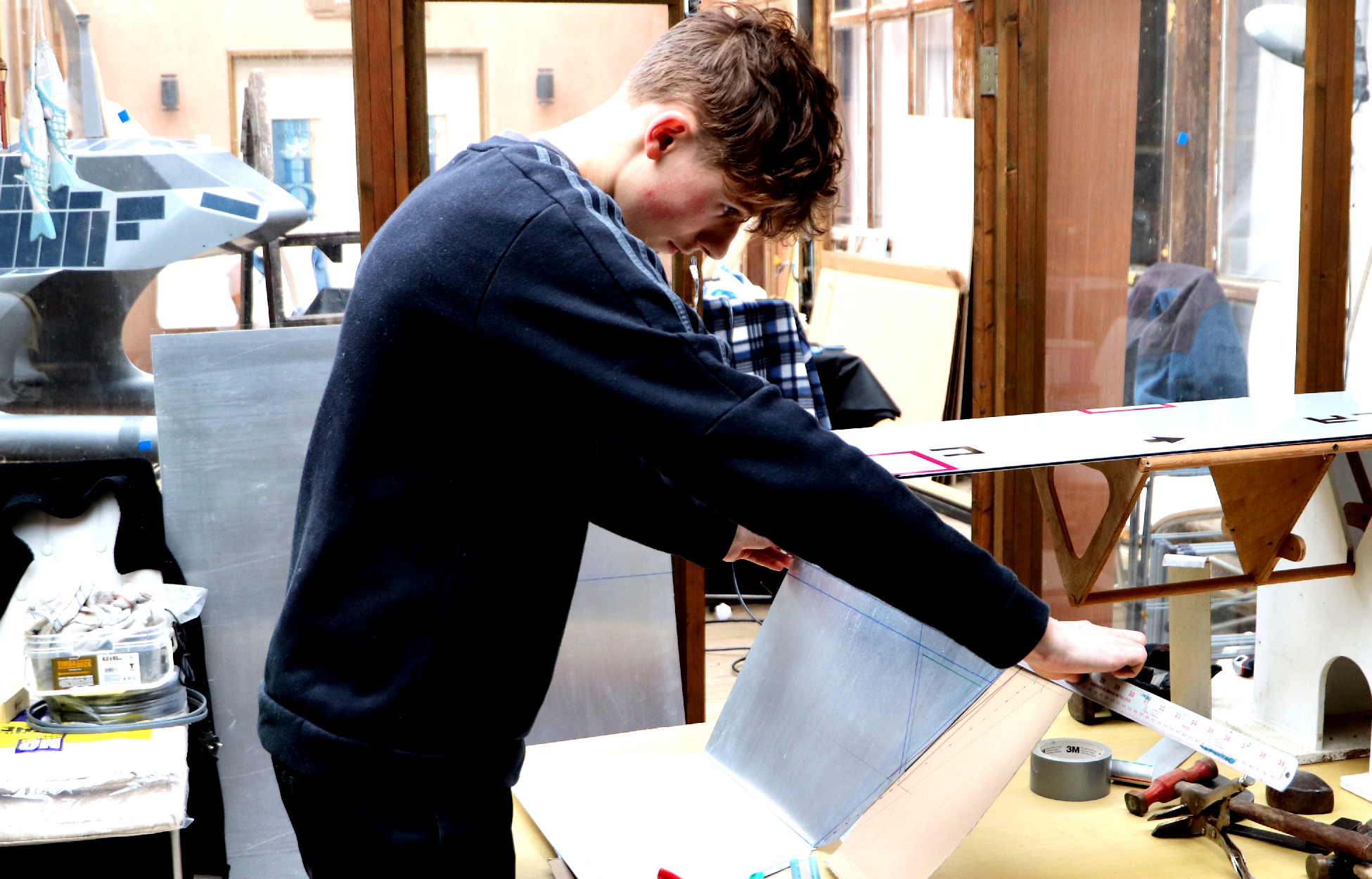 Measuring and cutting the alloy panels for the Queen of the Nile